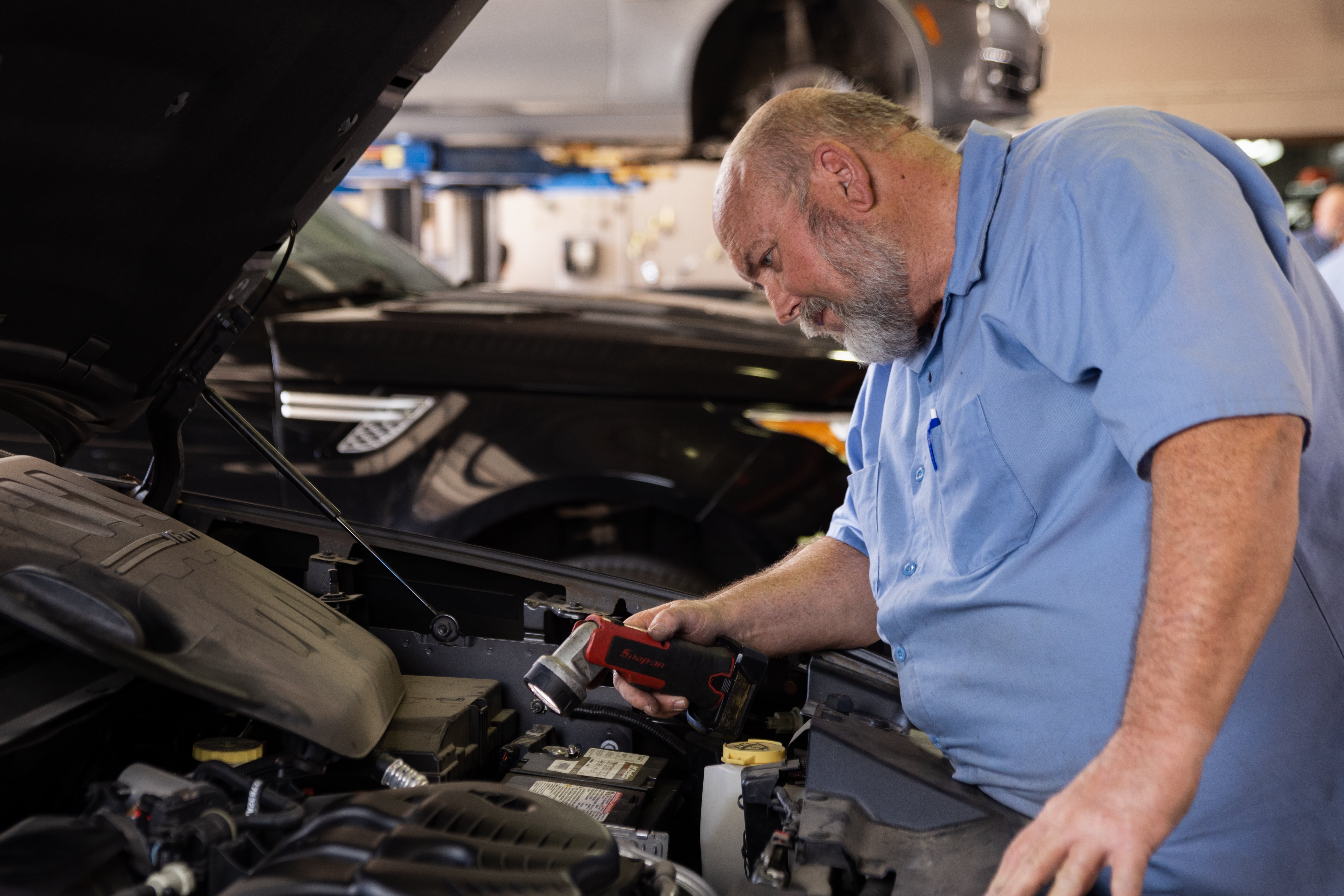 Mechanic diagnosing a check engine light