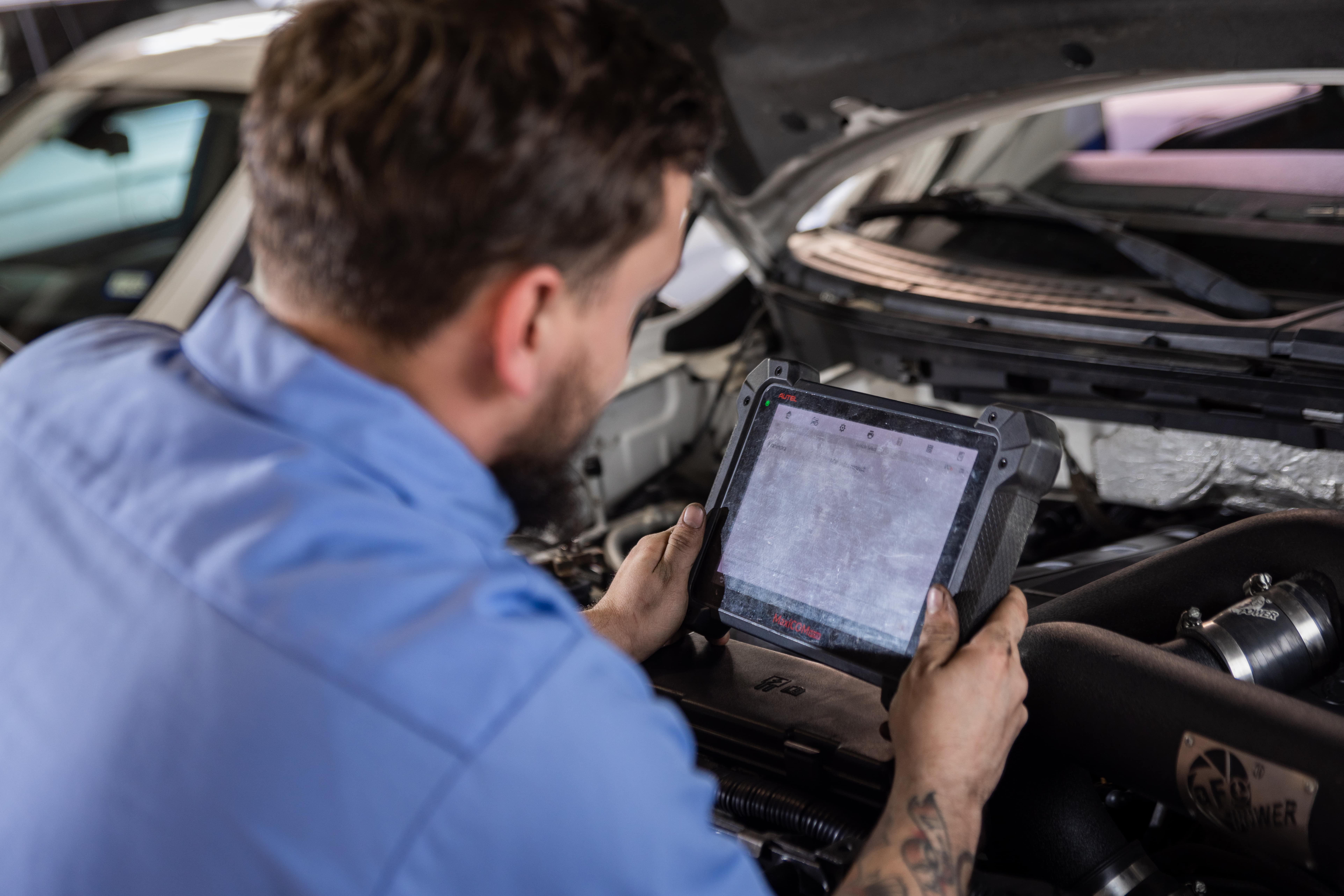 Mechanic diagnosing a check engine light